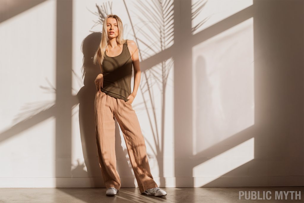 Women's linen pants outfit with bamboo organic cotton tank top in earthy neutral colors